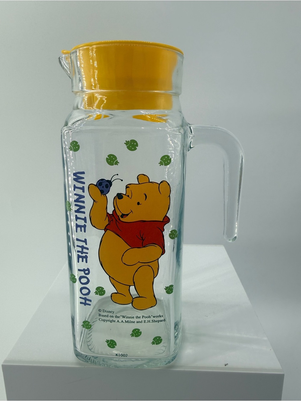 Disney Winnie the Pooh Glass Pitcher with Yellow Lid and Red Accents